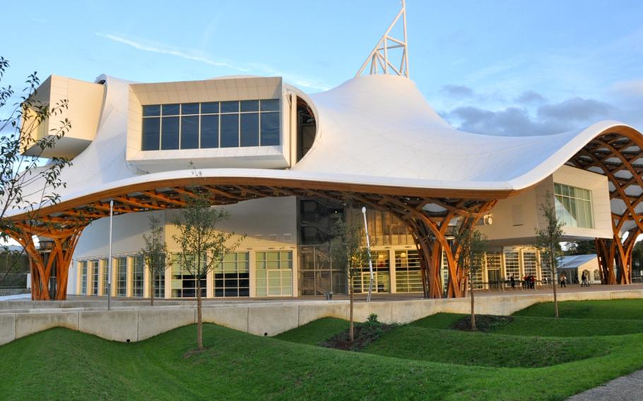 The Centre Pompidou-Metz was designed by Japanese architect Shigeru Ban and France's Jean de Gastines. It has a translucent white skin that glows at night, making it look like a spaceship. Others have compared it to a toadstool or a 'Smurf house.'