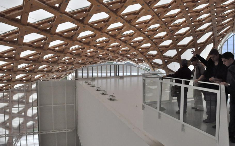 Visitors to the Centre Pompidou-Metz marvel at the elegant lattice of steel and wooden beams supporting the museum's undulating white roof.