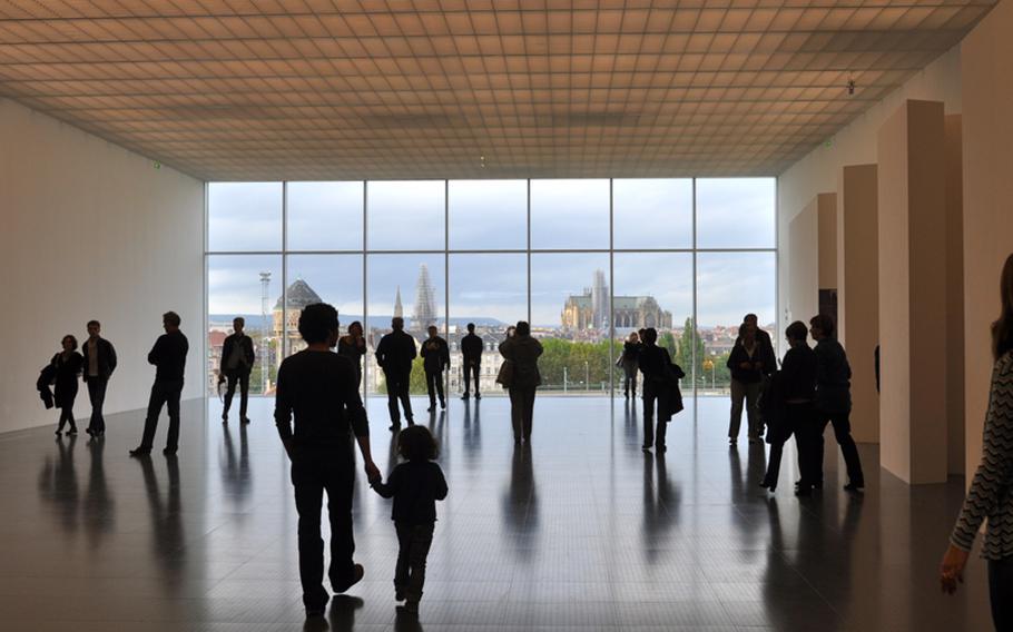From the museum's top floor, visitors look out of a grand window, which provides a panoramic view of Metz. If you go, walk back from the window and watch as the Metz cathedral grows larger, thanks to an optical illusion.