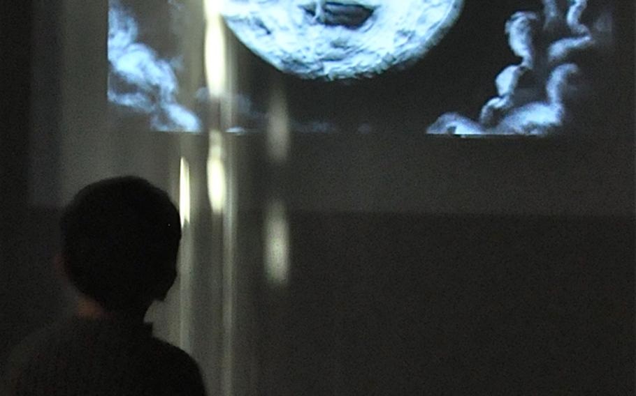 A boy watches the famous moon landing in Georges Méliès’ 1902 science-fiction fantasy 'A Trip to the Moon.' A reinterpretation of the short film was showing in one of the of the side rooms, which provide a nice respite for museum walkers.