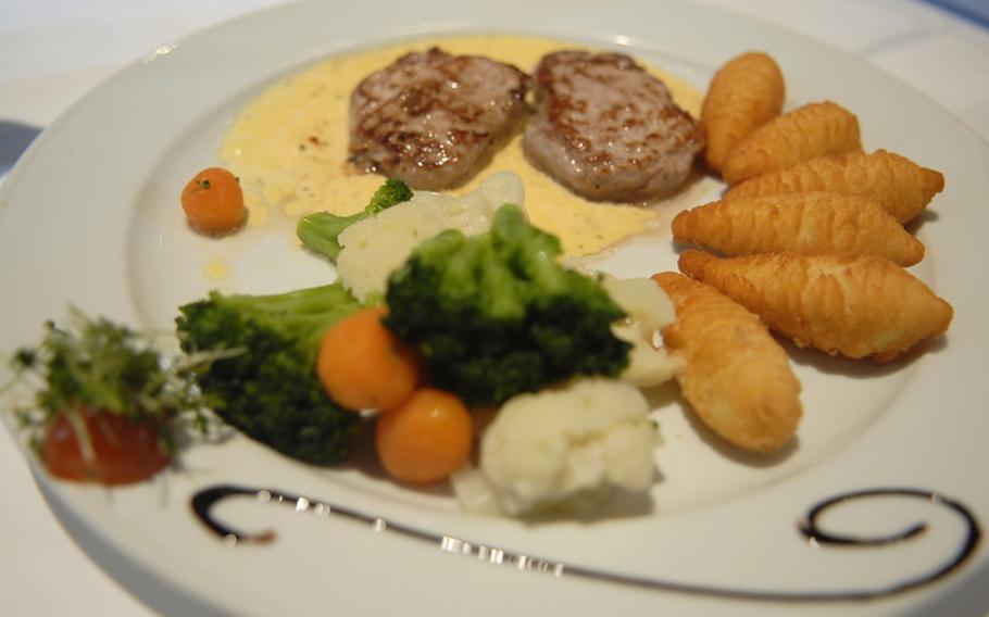 Food at the Blechhammer in Kaiserslautern, Germany, is a mix of Palatinate and Italian Mediterranean specialties, ranging from the simple, like this basic dish of pork medallions with potato croquettes and vegetables, to the snazzier, such as homemade ravioli with white truffle sauce.