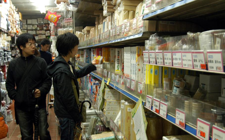 Shoppers look at various cooking utensils offered at Kappabashi. Whether you are professional or not, you can find various kinds of kitchen supplies at Kappabashi.