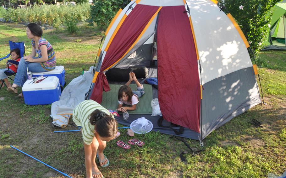 My family settles in at our camping spot at Tsugaru Earth Village during an outing earlier this summer.