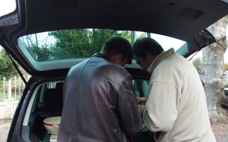 Selling the black diamonds at a truffle market for professionals is veiled in secrecy, with sellers and buyers crouching under car hoods to inspect the merchandise. They don't like to have their photos taken or to discuss their business with journalist for fear that some of their favorite hunting sites will be revealed.