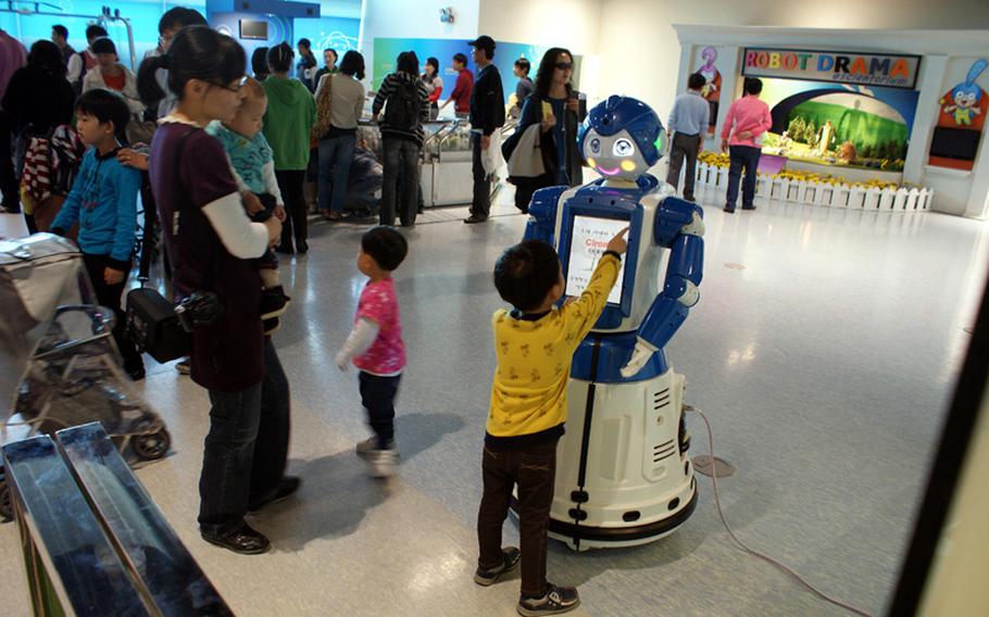 Children are encouraged to interact with robots exhibited in the Advanced Science & Technology Hall at the Gwacheon National Science Museum.