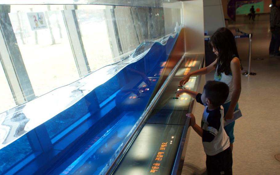 Natalya and Diego Jimenez learn about water waves during a visit to the Gwacheon National Science Museum.