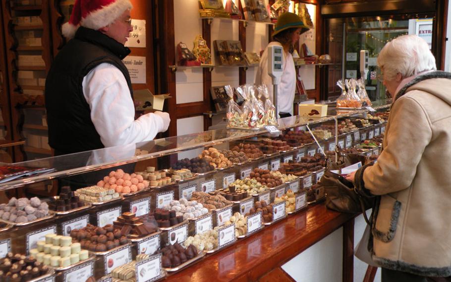 Hundreds of delicious bonbons await buyers at the Christmas market in Birmingham, England. Flavors come in many traditional flavors plus apple pie, passion fruit and a variety of liqueurs.