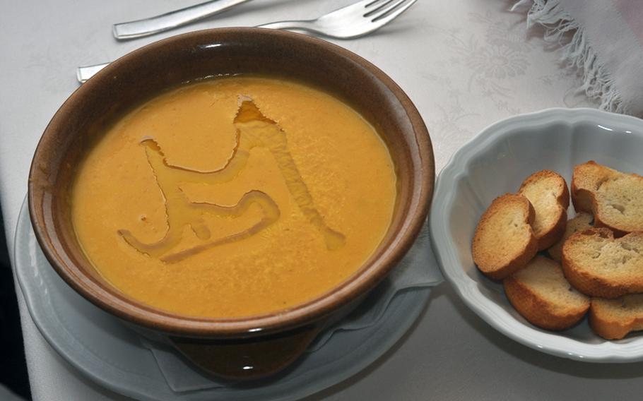 Grappolo D'Oro, a restaurant in the small town of Colle, Italy, about 18 miles northeast of Aviano, serves a variety of dishes featuring foods produced seasonally in the local area, including pumpkin soup (with a drizzle of olive oil on top).