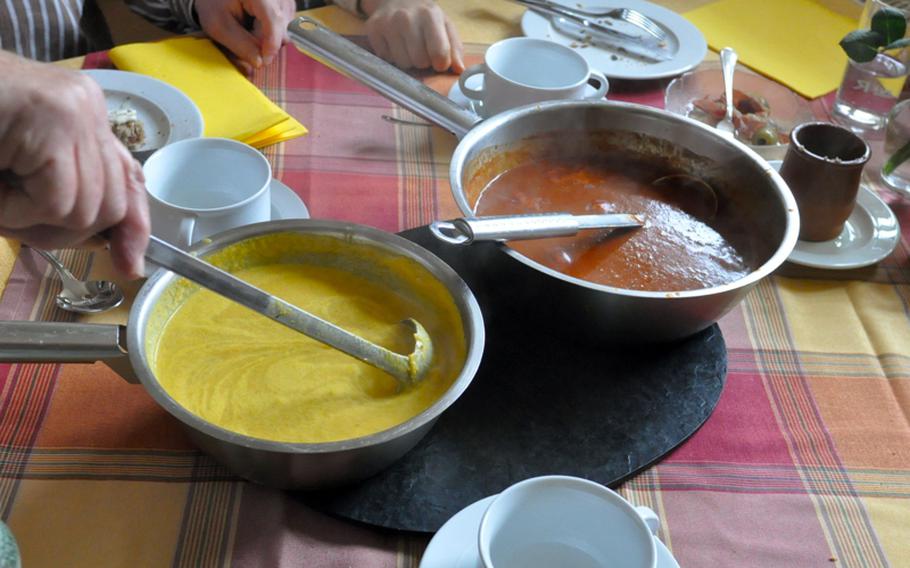 Gunther Ritter serves two pots of  soup -- one a delicate yellow curry soup, the other a bright red-orange creation made with cauliflower, leeks, celery and carrots, along with African spices and forest honey. He said it was inspired by a TV documentary he had been watching: 'Some African people were throwing it all in a pot and I wrote it down,' he said.