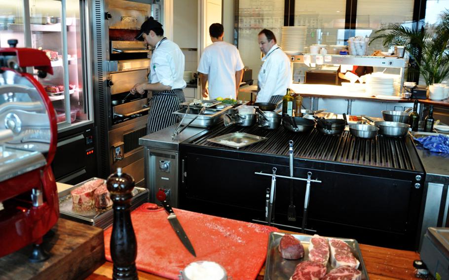 Cooks in the Christophorus steakhouse use a 1,500-degree-Fahrenheit oven to prepare high-priced dishes in the Porsche Museum in Stuttgart. The restaurant specializes in U.S. beef, but also serves venison, duck and fish.