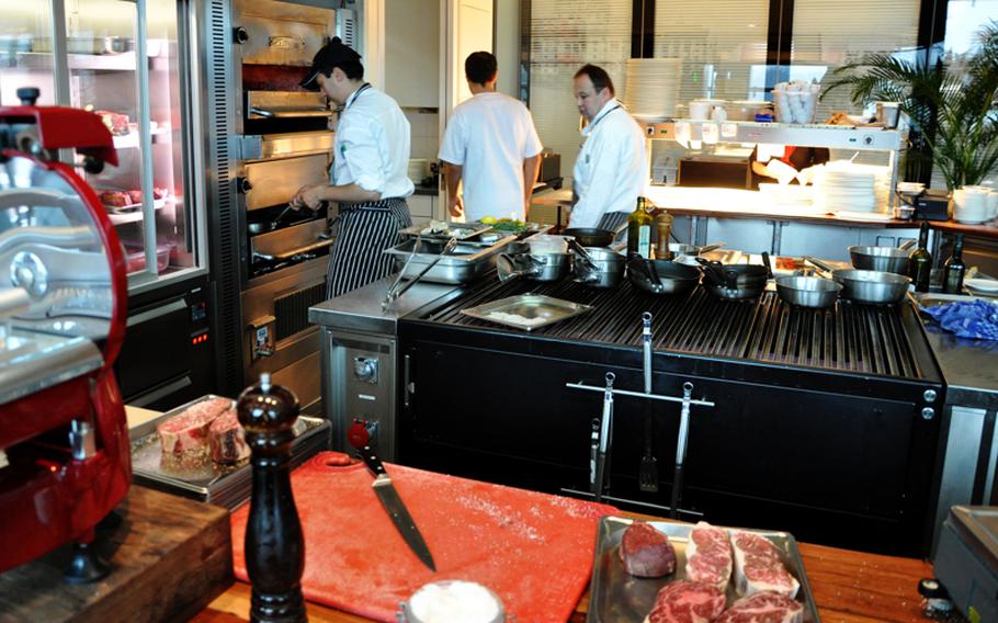 Cooks in the Christophorus steakhouse use a 1,500-degree-Fahrenheit oven to prepare high-priced dishes in the Porsche Museum in Stuttgart. The restaurant specializes in U.S. beef, but also serves venison, duck and fish. 