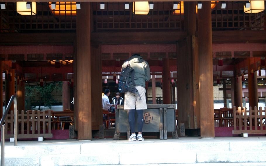 A visitor prays at the altar in Nogi Jinja in Tokyo.