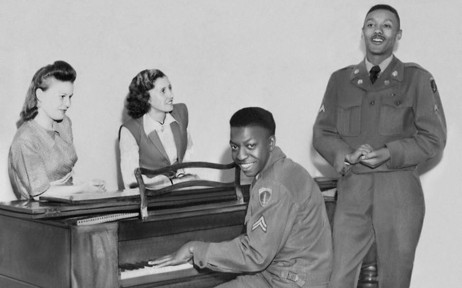 Irmgard Achatz from Kollbach, Germany, center, and one of her friends listen as her future husband, James W. Tanner of Philadelphia, sings while accompanied on piano by a fellow soldier. The life of black soldiers in Germany during and after World War II is the subject of a new book,  'A Breath of Freedom: The Civil Rights Struggle, African American GIs, and Germany.'