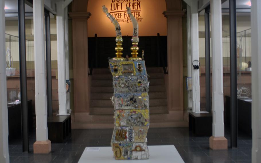 A mosaic-plastic sculpture called 2063 by Casim Wenzel stands at the entrance to the Prinzhorn Collection at the University of Heidelberg's psychiatry clinic.