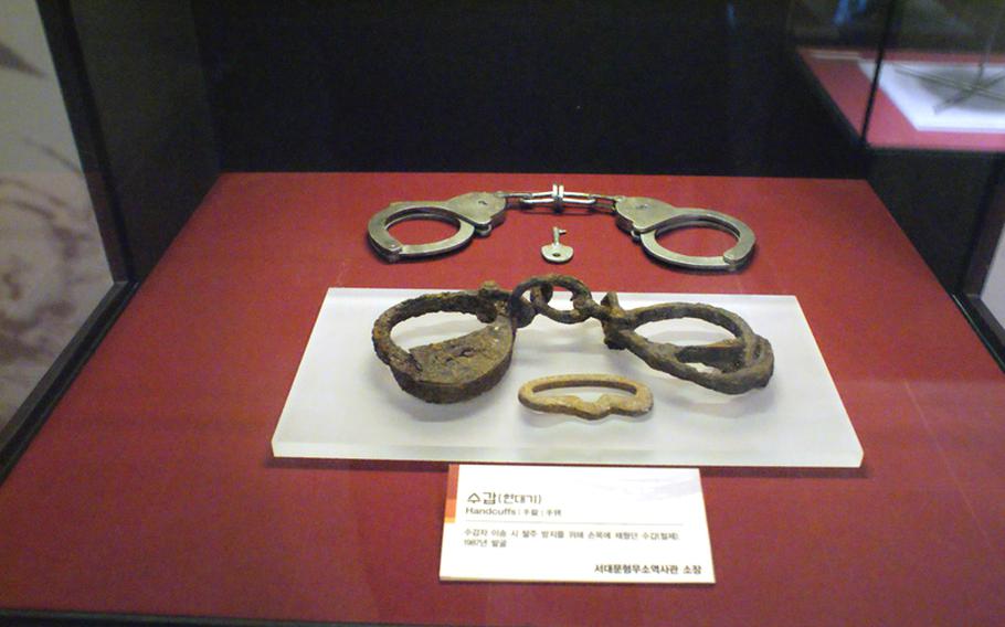 Handcuffs once worn by Korean prisoners are displayed at the Seodaemun Prison. Many were put in solitary confinement with no electricity and toilets.