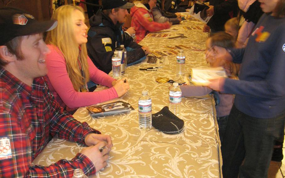 Members of the U.S. Olympic Ski Team, including, from left, Marco Sullivan, Lindsey Vonn and Ted Ligety, sign autographs during a visit to the Edelweiss Lodge and Resort. Vonn and Ligety are among the team members who will be back in Garmisch to meet fans and compete in the FIS Alpine World Championships.