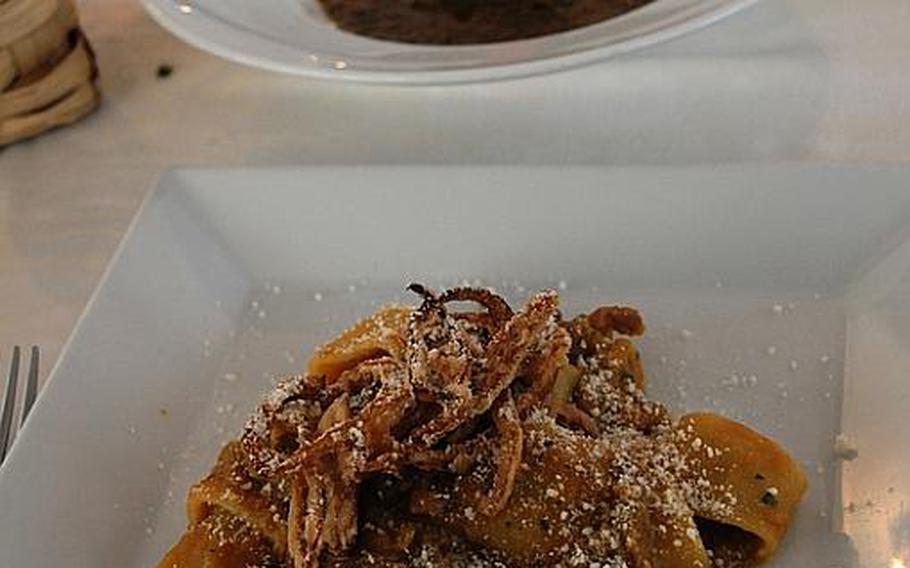 In the foreground, one of Trattoria da Gemma's signature dishes: large, tube-shaped pasta with Genovese sauce -- a spiced, onion and meat blend. In the background, a bowl of lentil soup with pork ribs confit, perfect for a cold day.
