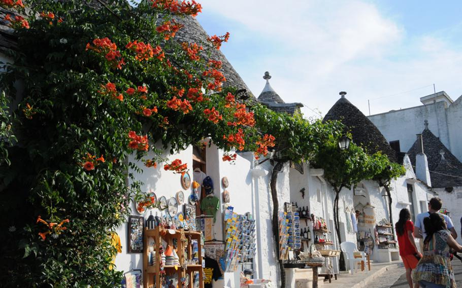 Flowers seem to always be in bloom in Alberobello, which means "beautiful tree." However, it's the uniquely conical shaped homes that are the main tourist attraction at the fairytale-like town in the southern Apulia region of Italy.