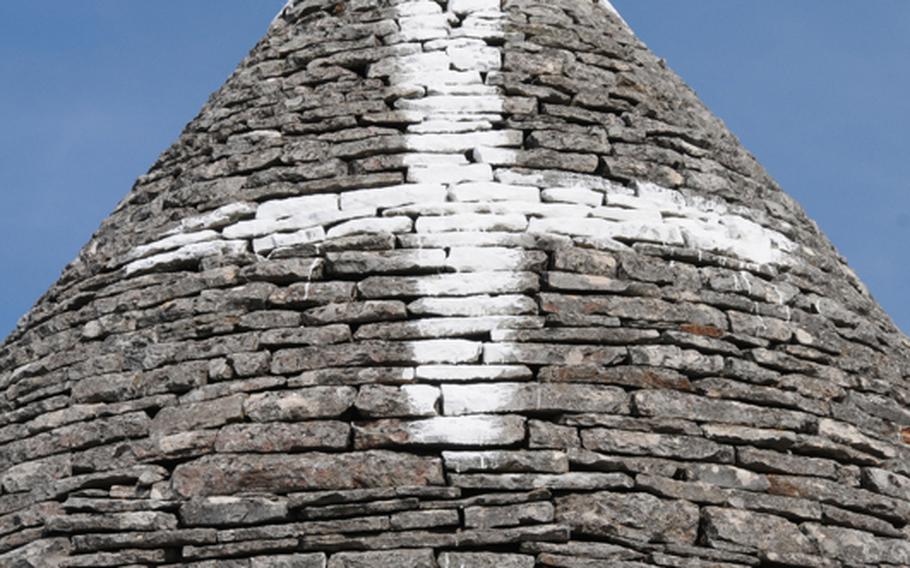 Many of the conical roofs of trulli homes are decorated with symbols that represent anything from family monograms to magical belief systems or religious preferences such as paganism or Christianity.