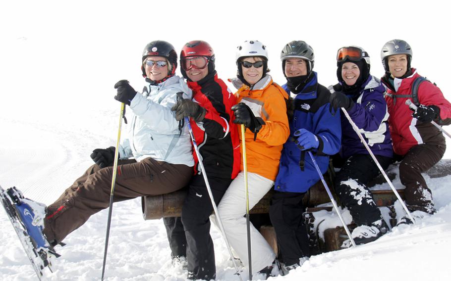 Heidelberg International Ski Club members members sit on a vintage World War II cannon during a trip to the Dolomites near Arabba, Italy, last season.