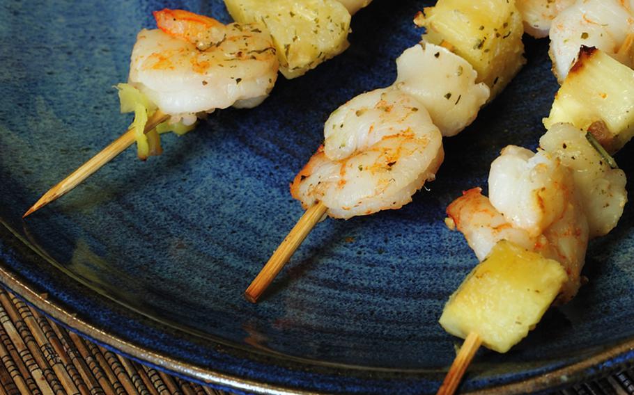 The first course, Grilled Shrimp, Sea Scallops and Pineapple Kabobs, can be grilled lightly or sauteed with olive oil. Serve with sliced fresh bread.