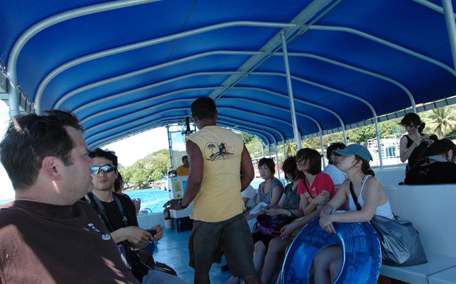 Passengers enjoy their boat ride on the way to Cocos Island.