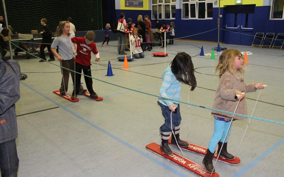 Teamwork is key when competing in the Buddy Board Relay, one of the events at the Landstuhl Elementary-Middle School's annual Family Wellness Night. Pictured, from left, are Rachel and Colin Kent, Bailey Duffy and Rachael Popiel.