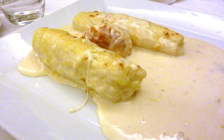 Pike dumplings au gratin with a creamy sauce was one course on a menu at the Au Cheval Blanc in Niedersteinbach, France.