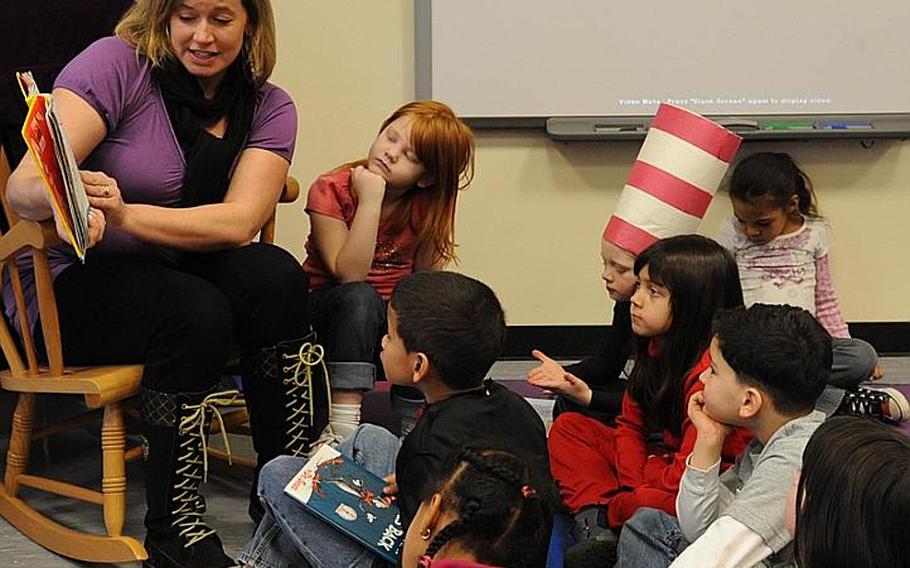 Bettina Boyd reads "One Fish, Two Fish, Red Fish, Blue Fish" to the first-grade class of her son, A.J.,  during the Hainerberg Elementary School&#39;s  Read Across America day. Celebrated on March 2, it also marks the birthday of Theodor Geisel, aka Dr. Seuss who was born on this day in 1904.  The event  started in 1998 by the National Education Association and has been held every year since.