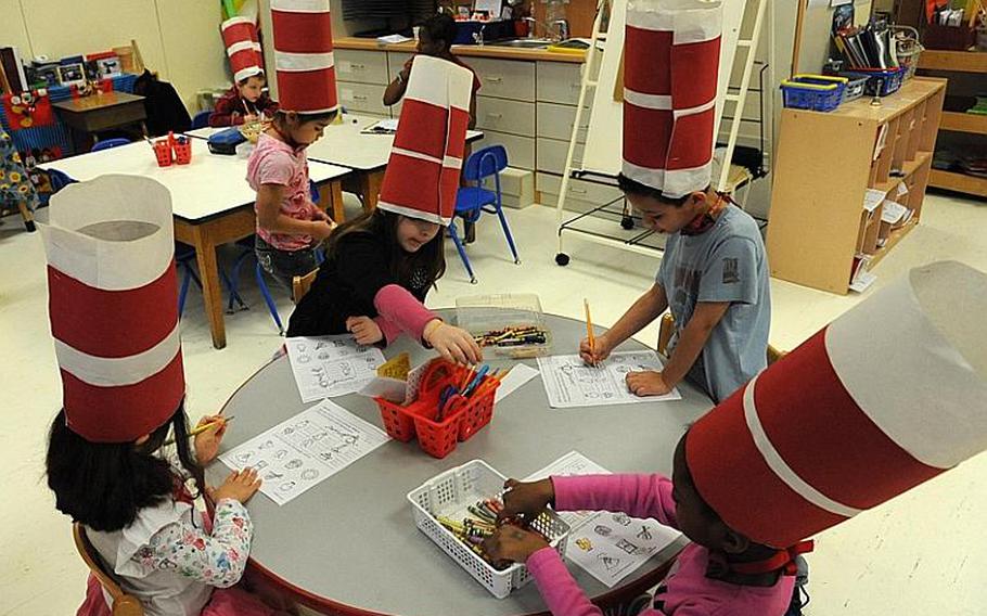 After eating green eggs and ham, Hainerberg kindergartners get back to work decked out in "Cat in the Hat" headgear. Wednesday marked the annual Read Across America Day,  also marks the birthday of Theodor Geisel, aka Dr. Seuss, who was born 115 years ago.
