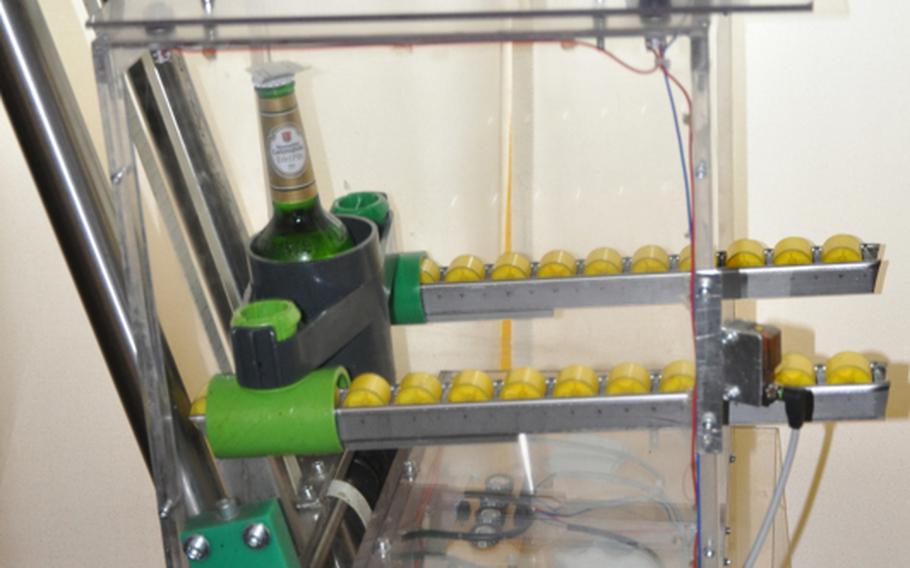 A beer takes a ride inside a container on one of the many conveyer belts in the 's Baggers restaurant near Nuremberg, Hermany.