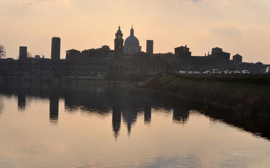The skyline of the Italian city of Mantova is reflected on the water of Lago Inferiore shortly before sunset during a recent visit. Mantova, less than an hour's drive from Vicenza, is called Mantua by English speakers.