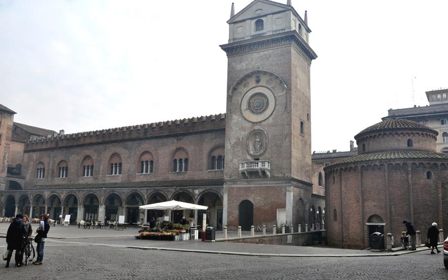 Piazza Erbe, featuring a clock tower and San Lorenzo's rotunda, is one of a handful of interesting squares within a short distance of each other in the heart of Mantova, an Italian city surrounded on three sides by lakes.