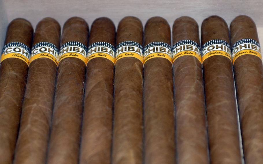 A row of Cuban Cohibas on display inside the Cigar Bar Lounge&#39;s temperature- and humidity-controlled walk-in humidor. The lounge features a wide sampling of drinks and premium cigars.