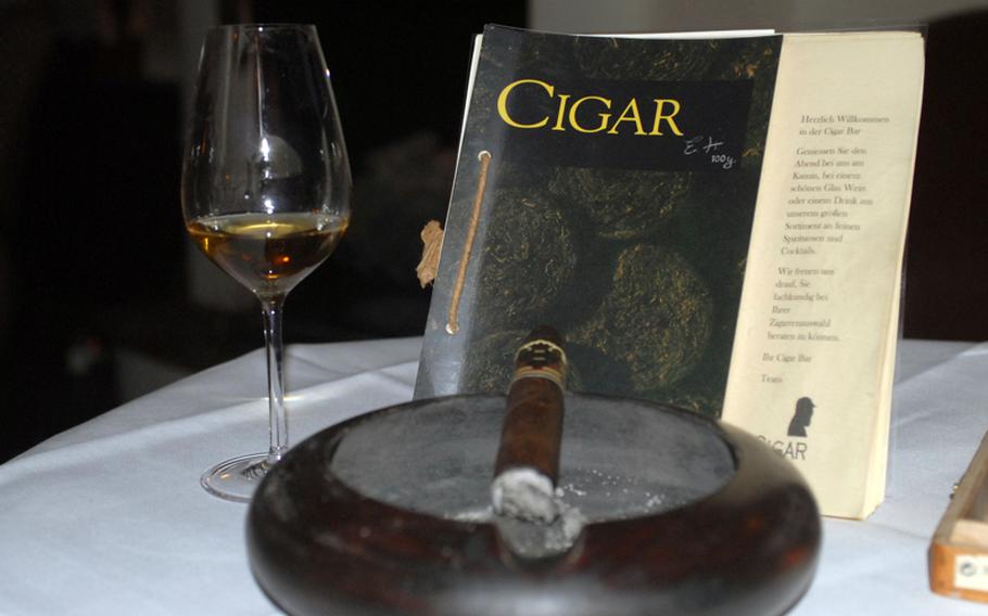 A cigar and a glass of single malt whisky can be a relaxing nightcap on a stressful day.  The Cigar Bar Lounge in Frankfurt, Germany has a variety of cigars and drinks for guests to enjoy.