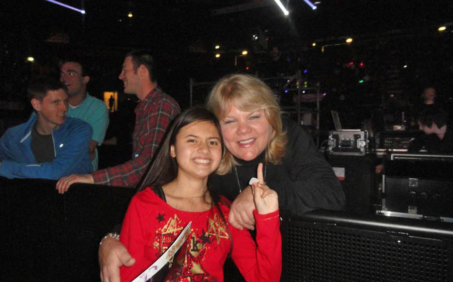 Jessica Kalnasy, with a guitar pick in one hand, poses for a photograph of Andrea Swift, mother of Taylor Swift, during the singer&#39;s concert near Milan, Italy on March 15. Jessica chatted with Andrea between acts and told her "I am Taylor?s biggest fan!?