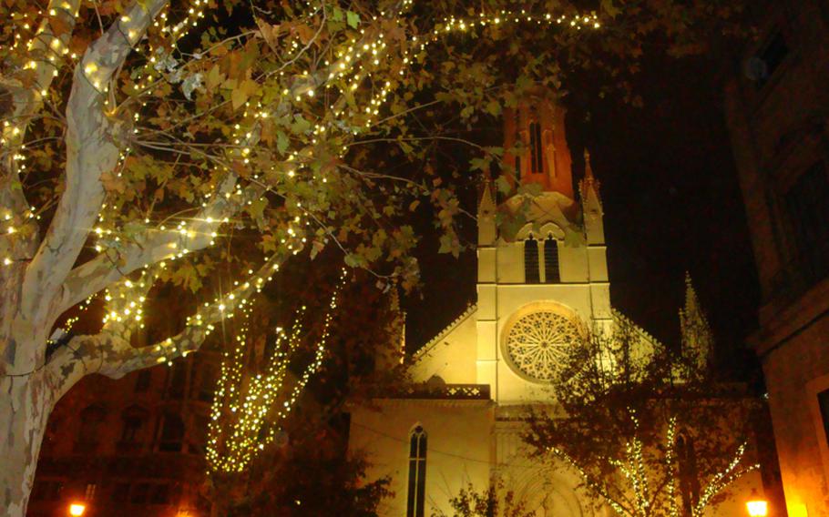 Lights hanging from trees illuminate the area around one of Palma de Majorca's churches. The city proved to be a good destination during the holiday off-season.