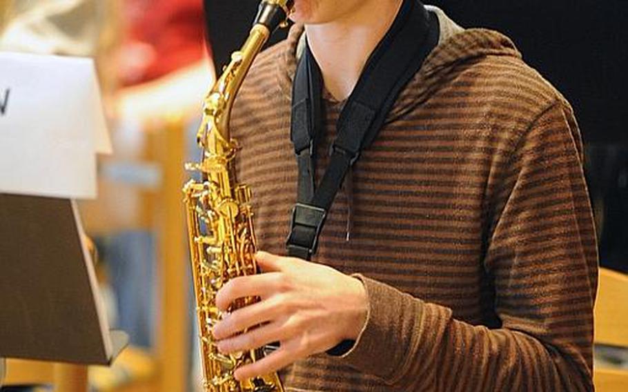 Baumholder High School, Germany's Justin Owens plays the sax during Honors Band rehearsals Wednesday at the weeklong Honors Music Festival in Oberwesel, Germany.