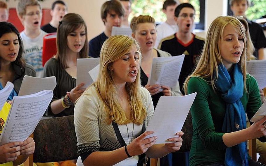 Claire Rumery, center, rehearses with the chorus Wednesday. This is the third year the Brussels junior has participated in the Department of Defense Dependents Schools-Europe Honors Music Festival.