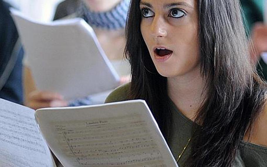 Nichole Pissierra from Alconbury High School, England, watches director Jeffery Ames as she and the Department of Defense Dependents Schools-Europe Honors Chorus rehearse in Oberwesel, Germany, on Wednesday. A total of 149 students from DODDS high schools throughout Europe participated in the weeklong Honors Music Festival.