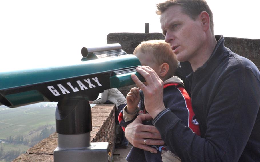 Horst Diemert and his 3-year-old son, Mika, peer through a telescope atop the Landeck Castle ruins. The castle serves as a playground for local children during the spring and summer months.

Seth Robbins/Stars and Stripes