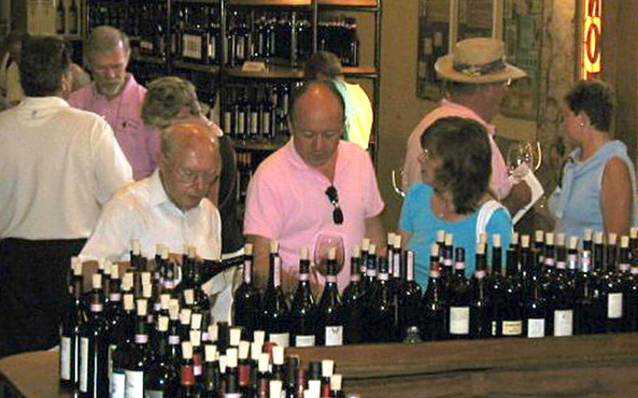 When wine producers put their product on the market, they often will have an open tasting event, such as this one featuring Barolo wines inside a castle in the village of Barolo, Italy.