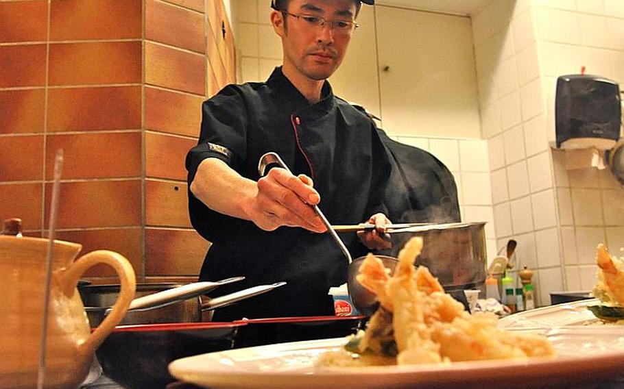 Koichiro Hazama, the chef at Brasserie Hashimoto, serves up some miso soup. The restaurant, in the heart of St. Johannes Markt in Saarbrücken, Germany,  is all about authentic Japanese cooking.