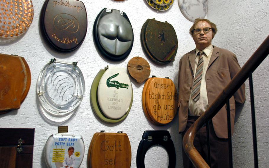 A life-size sculpture of a toilet care-taker in former East Berlin's TV tower toilet now guards a crazy collection of toilet seats in the stairwell of the Klooseum. The sculpture was the work of an artist from the former East Germany.