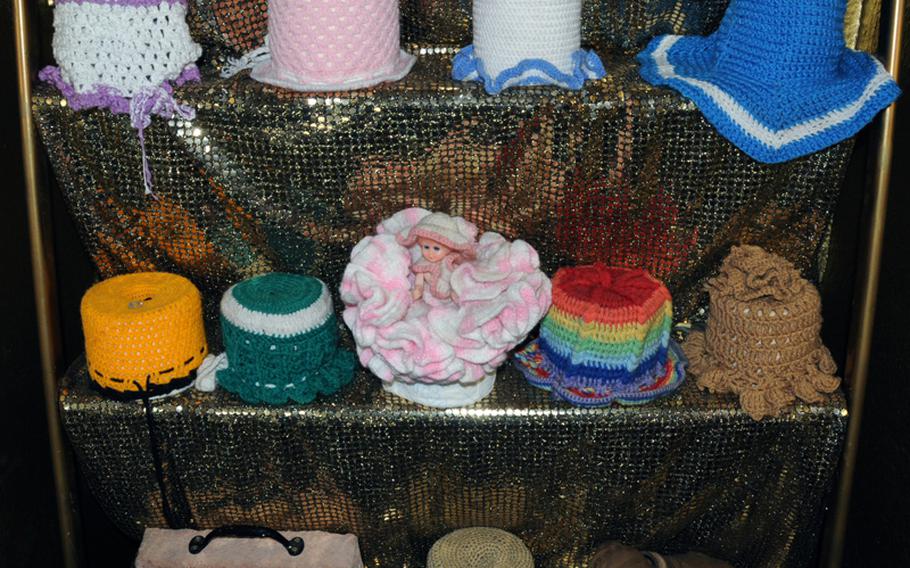 A display of knitted toilet-paper covers at the museums. Germans used to display the fancy and colorful covers in the rear window of their cars.