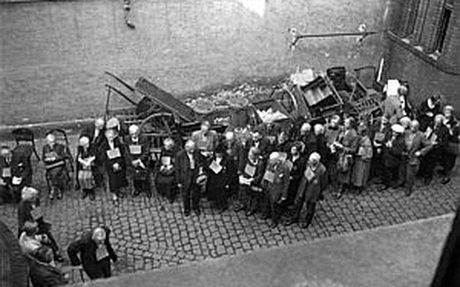 A group of older Jews wait to be registered on Aug. 29, 1942, in the courtyard of the synagoge in Wiesbaden, Germany, before being deported to concentration camps.

Courtesy of Archiv Rudolph