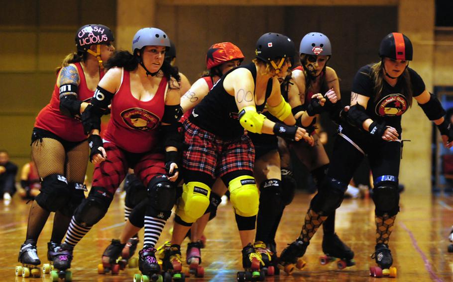 Kokeshi Roller Derby team members battle for position during a May 14 derby on Okinawa.