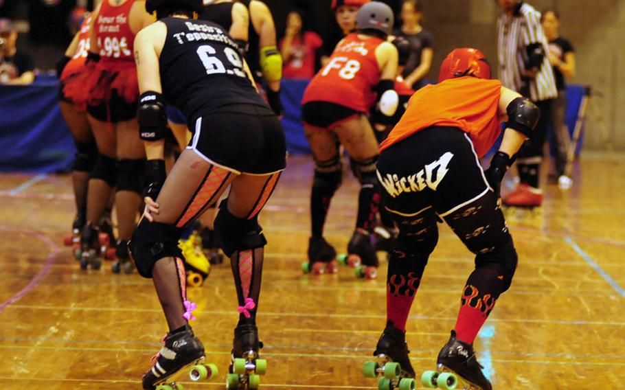 Kokeshi Roller Dolls skaters wait to kick off a derby May 14 on Okinawa, Japan.