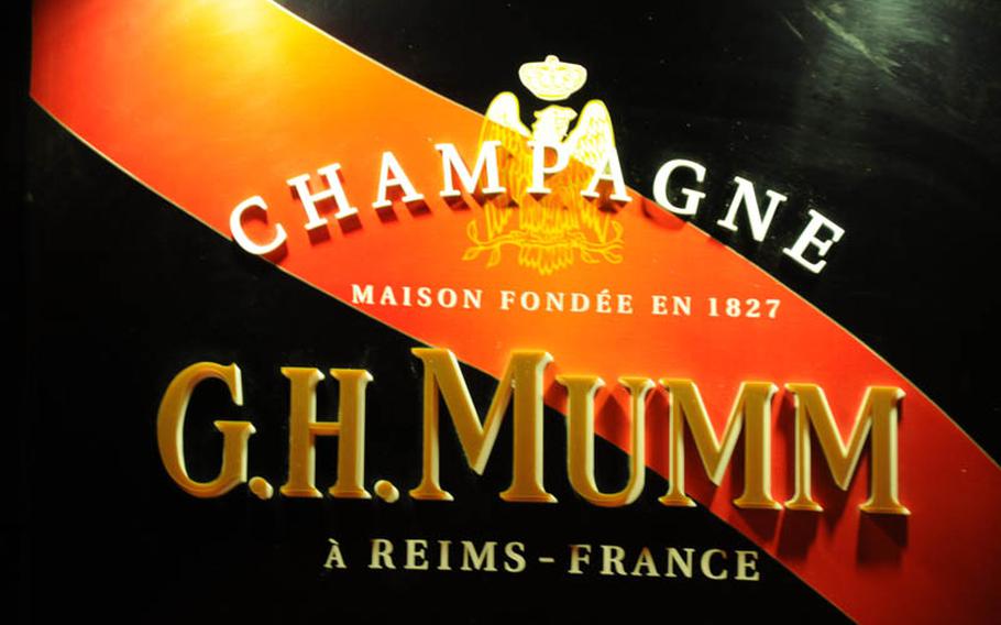 Sign outside the G.H. Mumm cocktail lounge on Via Santilli in the Port area of Pozzuoli advertises the pub in the  Neapolitan suburb.