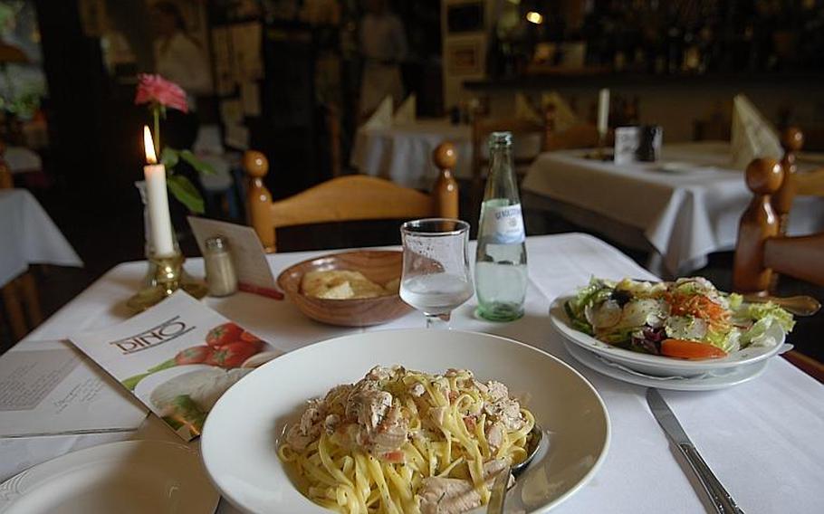 The fettuccini and salmon and a salad  make for a hearty meal at Dino&#39;s restaurant in Hohenecken, Germany. 
